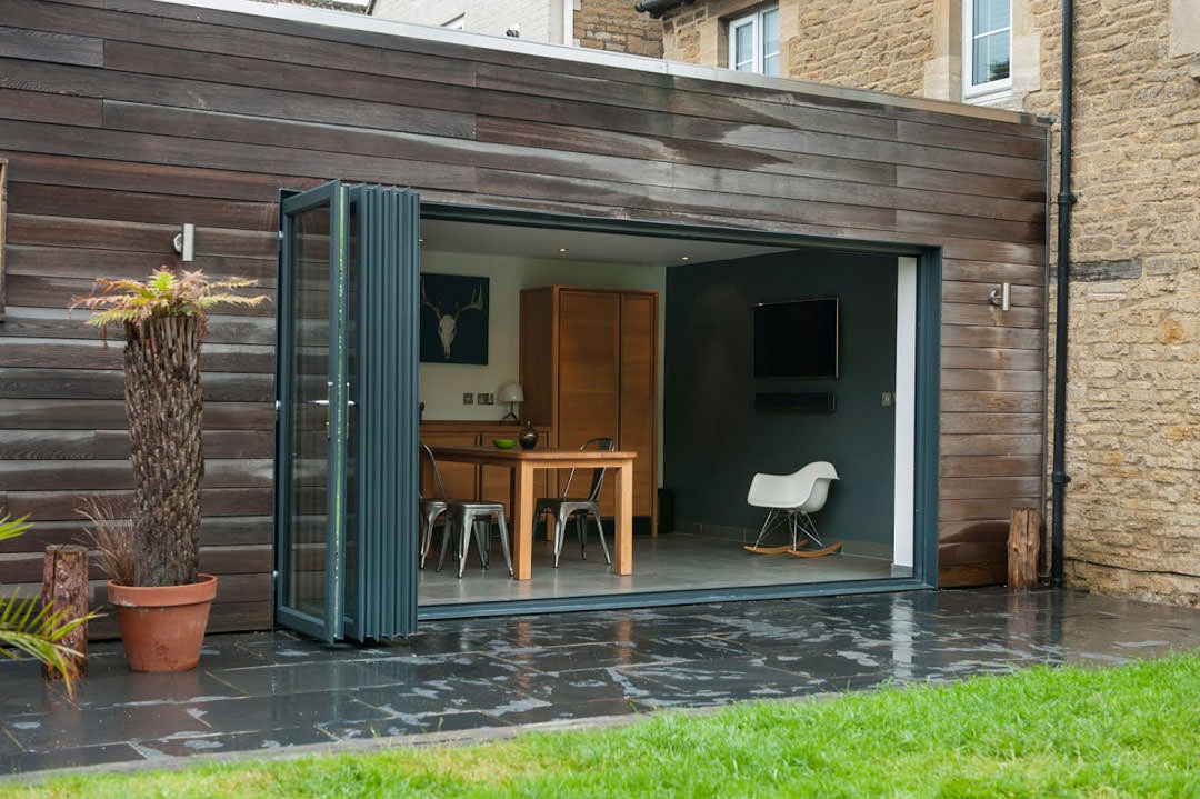 Grey aluminium bi-folding sliding doors