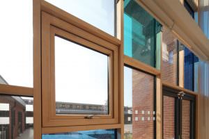 Hybrid composite windows  for commercial outlets 
